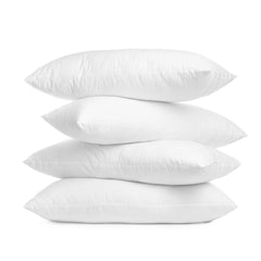 Stack of white pillows on a white background