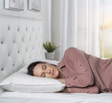Women side sleeping on bed with pillow